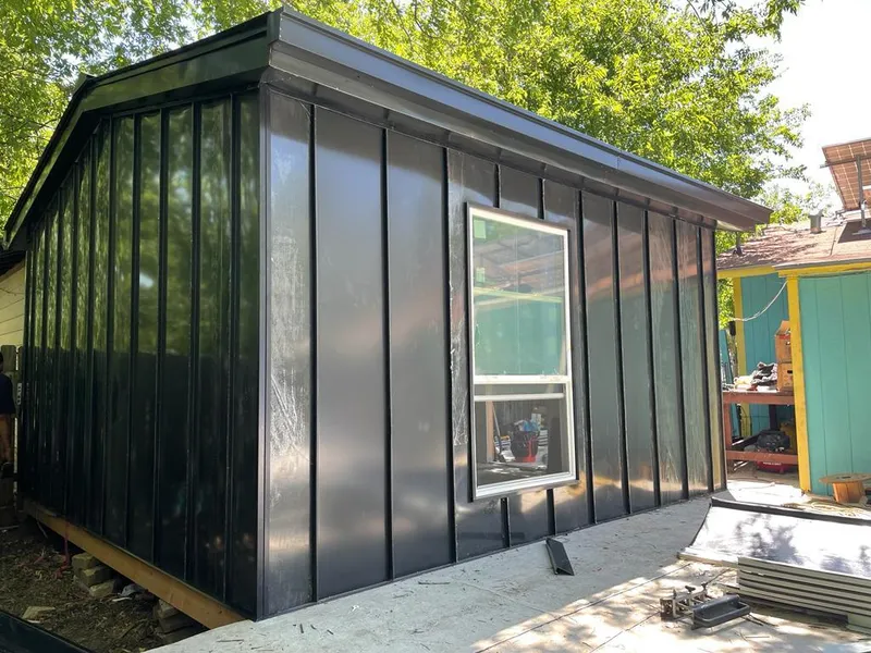 Black standing seam metal wall panels for Metal Roof Installation in Hudsonville