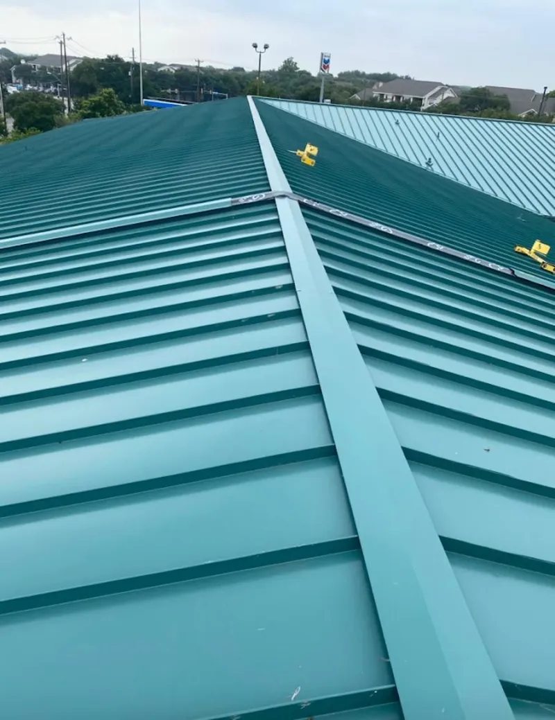 Green commercial metal roof ridge and valley for Metal Roof Repair in Hudsonville